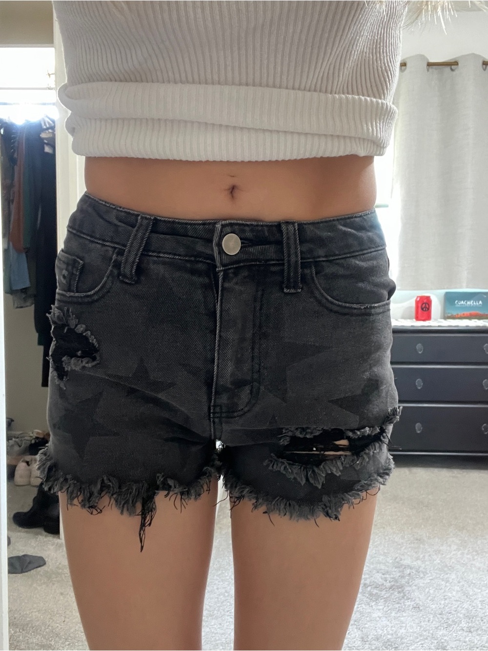 Black denim distressed shorts with star pattern